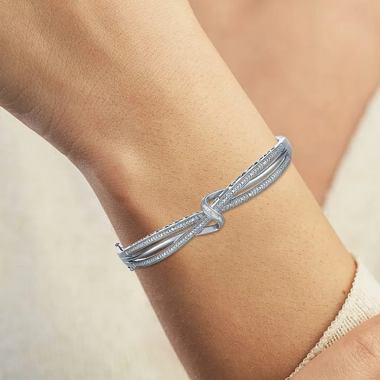 1/10 CT. T.W. Diamond Crossover Bangle Bracelet in Sterling Silver or 14K Gold Over Silver